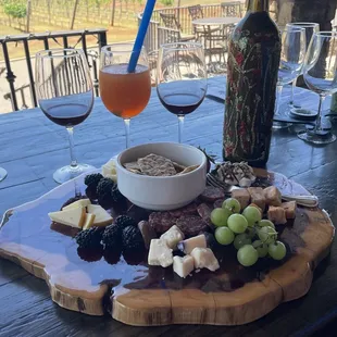 Beautiful outdoor patio with wine and charcuterie board.