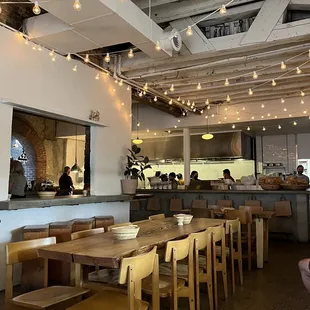 a dining area with tables and chairs