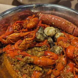 2 lbs crawfish with mushrooms and a sausage in Zaddy sauce