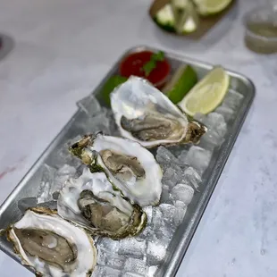 Happy hour raw oysters $9, 10/10