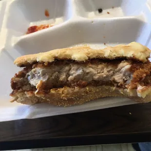 a half eaten meatball sandwich