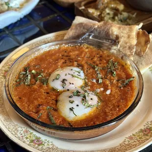 a bowl of soup and bread