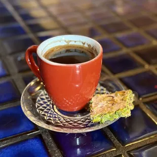 a cup of coffee and a biscuit