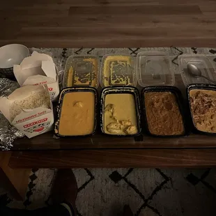 Fish Pakora, Bengan Bhartha, Chicken Coconut Curry, Prawns Goa Curry, Hydrabadi Lamb, and Chili Naan