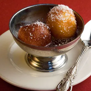 three doughnuts in a bowl