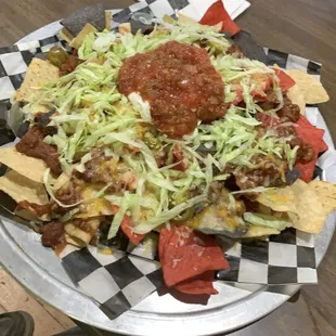 Full order of nachos... says it serves 4 but I smashed the entire thing myself.  It was DELICIOUS!
