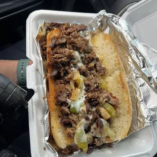 Philly cheesesteak with peppers, mushrooms and onion