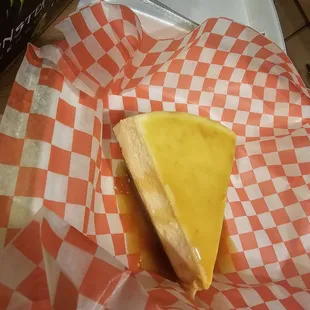 a cheese sandwich in a basket