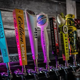 a row of beer taps
