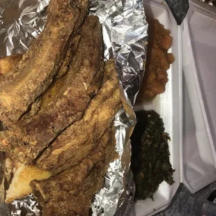 a tray of fried fish and other foods