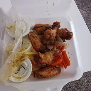 Blue cheese and lemon pepper wings with carrots and celery.