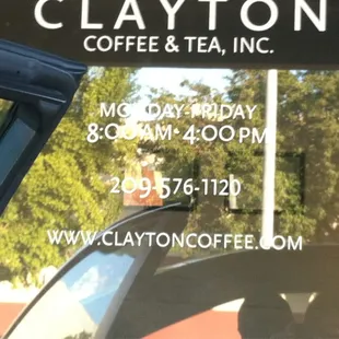 a reflection of a car in the window