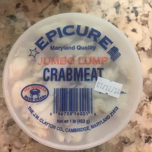 a plastic container of crabmeal