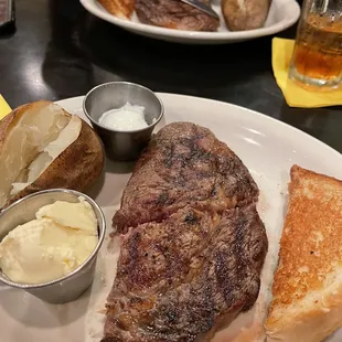 10z ribeye with baked potato and toast