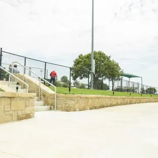 The walking trail surrounding the pond connects to the football fields at Chandler Park, where Mansfield Pee Wee Football plays.