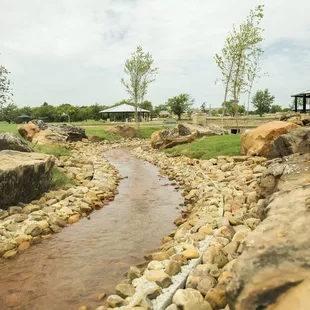 The pond is fed with water from an underground spring via a rockbed creek.
