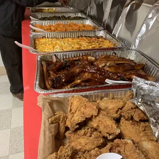 a buffet of chicken, macaroni and cheese