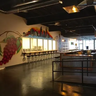 Our tasting room and amazing custom mural created in partnership with Graffiti HeArt!