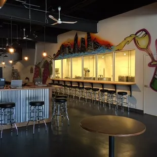 Our tasting bar (left) and shelf bar (right) that provides a bird's eye view of the activities going on inside the wine production area.