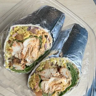 "Grilled chicken or falafel, spinach, turmeric rice, pickled onions, chopped salad, crispy chickpeas, hummus &amp; chipotle tahini sauce."