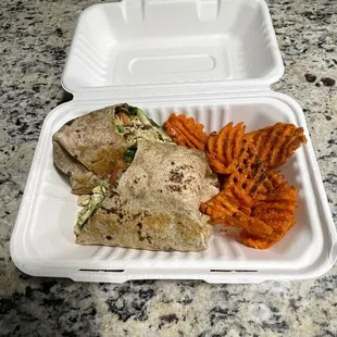 A chicken pesto wrap and sweet potato fries $10.15