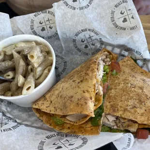 a sandwich and a side of macaroni and cheese