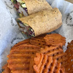 a wrap and sweet potato fries
