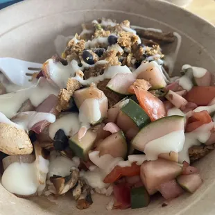 Build A Bowl Medium-brown rice, black bean burger, mushrooms, red onion, cucumber salad and queso