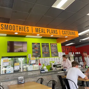 customers sitting at tables in a restaurant