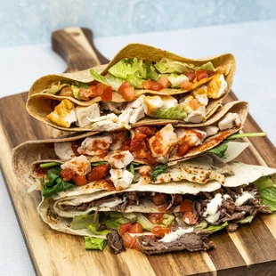 a stack of tortillas on a cutting board