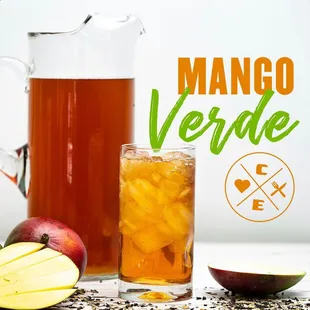 a pitcher of mango verd next to sliced apples