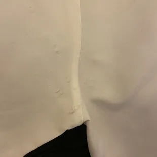 Arm pit area of a white button up dress shirt