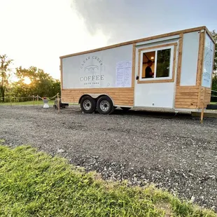 a coffee trailer parked in a parking lot