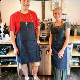 a man and a woman standing in a kitchen