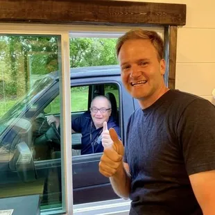 a man giving a thumbs up