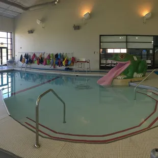 Indoor baby pool with frog slide. Party Room available for birthday parties!