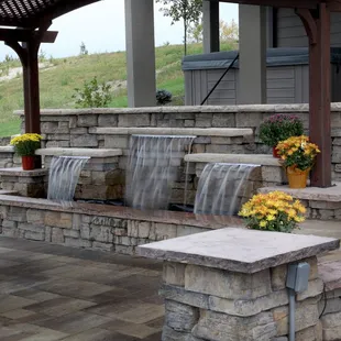 a patio with a waterfall