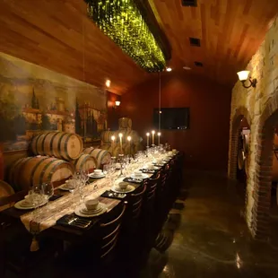 a long table with wine barrels