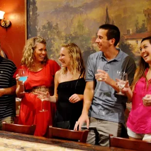 a group of people enjoying a wine tasting