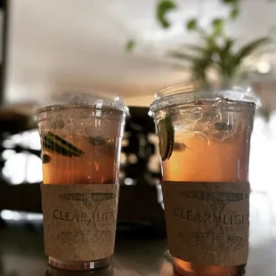 two cups of clear light coffee