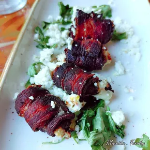 Bacon wrapped dates with goat cheese.  Don&apos;t let the burn appearance fool you.  They were delicious!