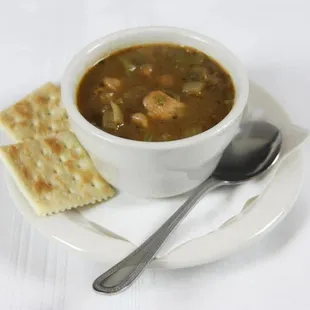 a bowl of soup and crackers
