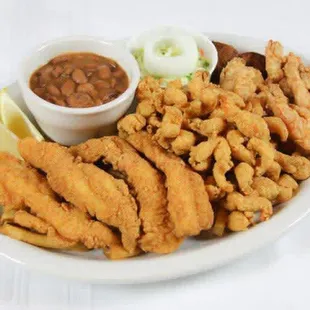 a plate of fried fish and beans