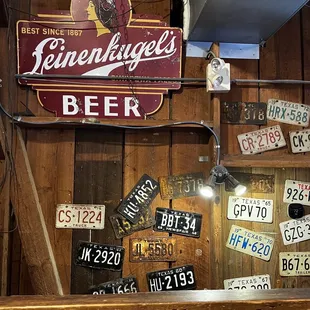 a bar with license plates on the wall