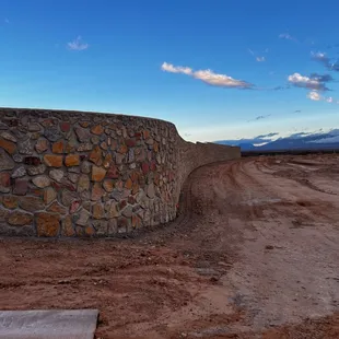 Radius retaining wall. 900' long x 15' tall.