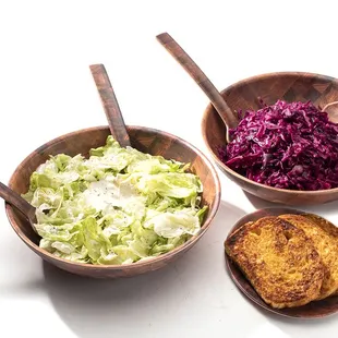 House Salad and Red Cabbage Salad with a plate of Cheese Bread