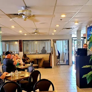 dining area with people sitting at tables