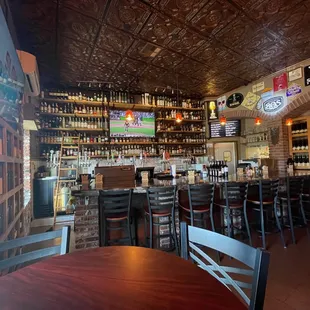 a bar with lots of bottles of wine