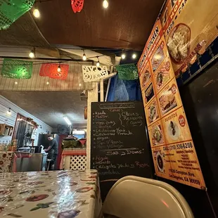 a mexican restaurant with a chalkboard menu