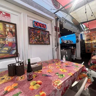 a dining area with a table and chairs